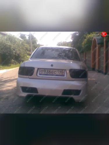 Задний бампер R1 Mitsubishi Carisma (1996-1999)